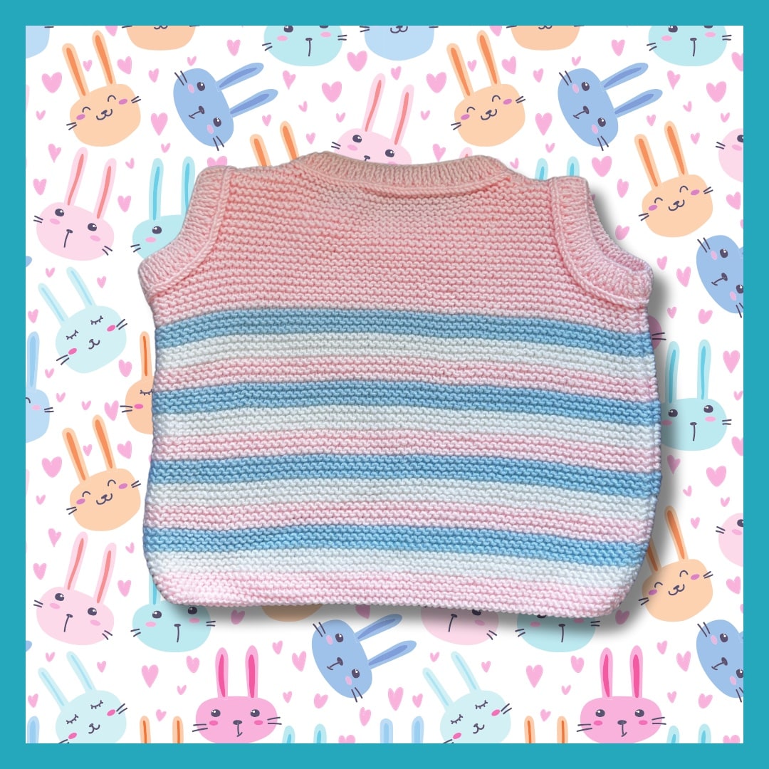 Pink sweater with white and blue stripes